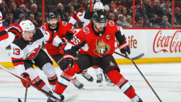 OTTAWA, ON - FEBRUARY 7: Erik Karlsson #65 of the Ottawa Senators stickhandles the puck against Nico Hischier #13 of the New Jersey Devils at Canadian Tire Centre on February 7, 2018 in Ottawa, Ontario, Canada. (Photo by Francois Laplante/NHLI via Getty Images)