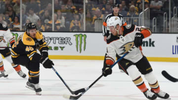 BOSTON, MA - OCTOBER 14: David Krejci #46 of the Boston Bruins fights for the puck against Ondrej Kase #25 of the Anaheim Ducks at the TD Garden on October 14, 2019 in Boston, Massachusetts. (Photo by Steve Babineau/NHLI via Getty Images)