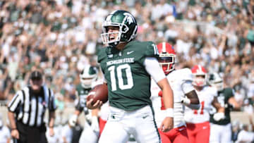 Sep 11, 2021; East Lansing, Michigan, USA; Michigan State Spartans quarterback Payton Thorne (10) celebrates his touchdown during the first quarter against the Youngstown State Penguins at Spartan Stadium. Mandatory Credit: Tim Fuller-USA TODAY Sports