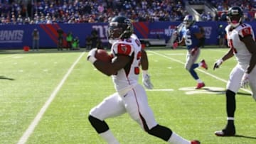 Oct 5, 2014; East Rutherford, NJ, USA; Atlanta Falcons running back Antone Smith (35) rushes down the sideline for a touchdown against the New York Giants during the second half at MetLife Stadium. The New York Giants defeated the Atlanta Falcons 30-20.Mandatory Credit: Noah K. Murray-USA TODAY Sports