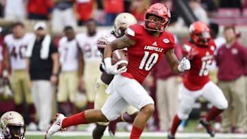 Sep 17, 2016; Louisville, KY, USA; Louisville Cardinals cornerback Jaire Alexander (10) looks back as he runs in a punt return for a touchdown against the Florida State Seminoles during the second half at Papa John