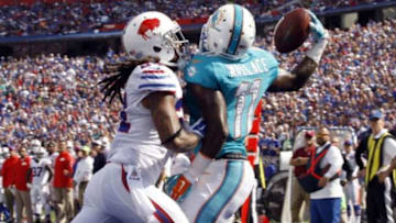 Sep 14, 2014; Orchard Park, NY, USA; Miami Dolphins wide receiver Mike Wallace (11) makes a one handed catch for a touchdown while being defended by Buffalo Bills cornerback Stephon Gilmore (24) during the second half at Ralph Wilson Stadium. Buffalo beats Miami 29 to 10. Mandatory Credit: Timothy T. Ludwig-USA TODAY Sports