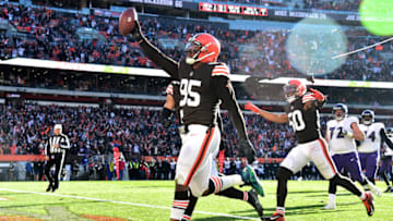 CLEVELAND, OHIO - DECEMBER 12: Myles Garrett #95 of the Cleveland Browns celebrates after running the ball in for a touchdown after a fumble recovery in the second quarter against the Baltimore Ravens at FirstEnergy Stadium on December 12, 2021 in Cleveland, Ohio. (Photo by Jason Miller/Getty Images)