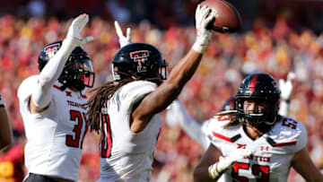 AMES, IA - OCTOBER 27: Linebacker Dakota Allen #40 of the Texas Tech Red Raiders celebrates with teammates defensive back Justus Parker #31, and defensive lineman Eli Howard #53 of the Texas Tech Red Raiders after recovering a fumble in the end zone to score a touchdown in the second half of play at Jack Trice Stadium on October 27, 2018 in Ames, Iowa. The Iowa State Cycloneswon 40-31 over the Texas Tech Red Raiders. (Photo by David Purdy/Getty Images)