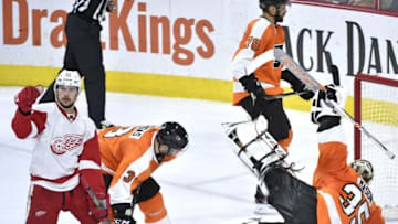 Mar 15, 2016; Philadelphia, PA, USA; Detroit Red Wings left wing Tomas Tatar (21) celebrates his goal against Philadelphia Flyers defenseman Radko Gudas (3) and goalie Steve Mason (35) during the third period at Wells Fargo Center. The Flyers defeated the Red Wings, 4-3. Mandatory Credit: Eric Hartline-USA TODAY Sports