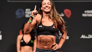 ABU DHABI, UNITED ARAB EMIRATES - JANUARY 22: In this handout image provided by the UFC, Amanda Ribas of Brazil poses on the scale during the UFC 257 weigh-in at Etihad Arena on UFC Fight Island on January 22, 2021 in Abu Dhabi, United Arab Emirates. (Photo by Jeff Bottari/Zuffa LLC via Getty Images)