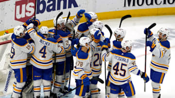 Mar 28, 2022; Chicago, Illinois, USA; Buffalo Sabres players celebrate their win against the Chicago Blackhawks at United Center. Mandatory Credit: David Banks-USA TODAY Sports