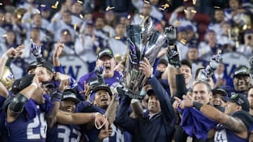 December 2, 2016; Santa Clara, CA, USA; Washington Huskies head coach Chris Petersen hoists the championship trophy after the Pac-12 championship against the Colorado Buffaloes at Levi