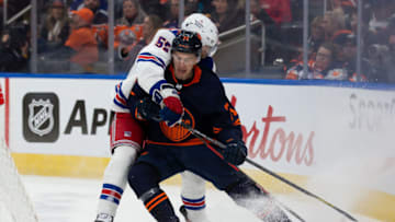 EDMONTON, AB - FEBRUARY 17: Ryan McLeod #71 of the Edmonton Oilers battles against Ryan Lindgren #55 of the New York Rangers during the second period of the game at Rogers Place on February 17, 2023 in Edmonton, Canada. (Photo by Codie McLachlan/Getty Images)