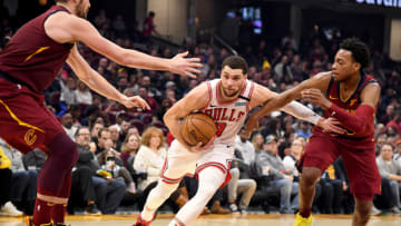CLEVELAND, OHIO - JANUARY 25: Zach LaVine #8 of the Chicago Bulls drives past Kevin Love #0 and Darius Garland #10 of the Cleveland Cavaliers during the first half at Rocket Mortgage Fieldhouse on January 25, 2020 in Cleveland, Ohio. NOTE TO USER: User expressly acknowledges and agrees that, by downloading and/or using this photograph, user is consenting to the terms and conditions of the Getty Images License Agreement. (Photo by Jason Miller/Getty Images)
