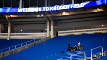 Dec 5, 2020; Lexington, Kentucky, USA; Kentucky Wildcats fans sit in mostly empty stands prior to the game against the South Carolina Gamecocks at Kroger Field. Mandatory Credit: Arden Barnes-USA TODAY Sports