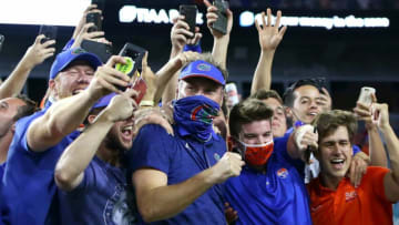 Florida head coach Dan Mullen celebrates with the Gator fans in the stands after the Gators beat the Bulldogs in the annual Florida Georgia rivalry game 44-28, held at TIAA Bank Field in Jacksonville Fla. Nov. 7, 2020.POY2020 F1g