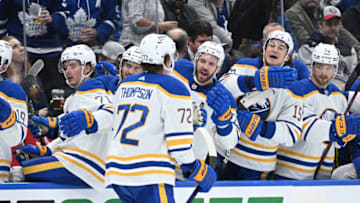 Apr 12, 2022; Toronto, Ontario, CAN; Buffalo Sabres forward Tage Thompson (72) celebrates with teammates after scoring a goal against the Toronto Maple Leafs in the second period at Scotiabank Arena. Mandatory Credit: Dan Hamilton-USA TODAY Sports