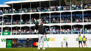 Feb 10, 2023; Scottsdale, AZ, USA; Jon Rahm reacts as the gallery roars after making his birdie putt on the 16th hole during round two at TPC Scottsdale. Mandatory Credit: Rob Schumacher-USA TODAY Sports