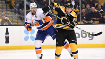 BOSTON, MA - DECEMBER 20: John Tavares #91 of the New York Islanders against Brad Marchand #63 of the Boston Bruins at the TD Garden on December 20, 2016 in Boston, Massachusetts. (Photo by Brian Babineau/NHLI via Getty Images)