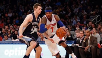 Dec 21, 2013; New York, NY, USA; New York Knicks small forward Carmelo Anthony (7) drives past Memphis Grizzlies power forward Jon Leuer (30) during the fourth quarter at Madison Square Garden. Memphis Grizzlies won 95-87. Mandatory Credit: Anthony Gruppuso-USA TODAY Sports