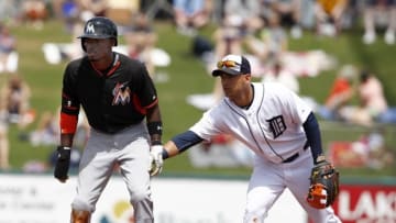 Mar 25, 2015; Lakeland, FL, USA; Detroit Tigers second baseman Ian Kinsler (3) taps Miami Marlins second baseman Dee Gordon (9) on the back during the first inning of a spring training baseball game at Joker Marchant Stadium. Mandatory Credit: Reinhold Matay-USA TODAY Sports