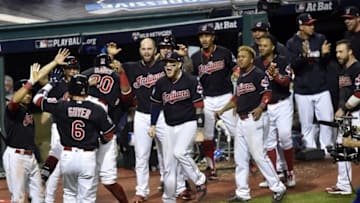 Nov 2, 2016; Cleveland, OH, USA; Cleveland Indians center fielder Rajai Davis (20) celebrates with teammates after hitting a two-run home run against the Chicago Cubs in the 8th inning in game seven of the 2016 World Series at Progressive Field. Mandatory Credit: David Richard-USA TODAY Sports