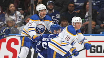 TORONTO, ON - APRIL 12: Owen Power #25 of the Buffalo Sabres levels Ilya Mikheyev #65 of the Toronto Maple Leafs while skating in his first career NHL game at Scotiabank Arena on April 12, 2022 in Toronto, Ontario, Canada. The Sabres defeated the Maple Leafs 5-2. (Photo by Claus Andersen/Getty Images)