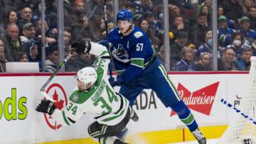 Apr 18, 2022; Vancouver, British Columbia, CAN; Vancouver Canucks defenseman Tyler Myers (57) checks Dallas Stars forward Denis Gurianov (34) in the second period at Rogers Arena. Mandatory Credit: Bob Frid-USA TODAY Sports