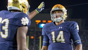 Oct 15, 2016; South Bend, IN, USA; Notre Dame Fighting Irish quarterback DeShone Kizer (14) is consoled by running back Josh Adams (33) after Notre Dame lost to the Stanford Cardinal 17-10 at Notre Dame Stadium. Mandatory Credit: Matt Cashore-USA TODAY Sports