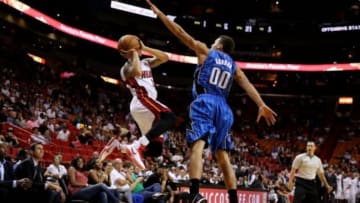 Oct 7, 2014; Miami, FL, USA; Miami Heat guard Shabazz Napier (13) shoots the ball over Orlando Magic forward Aaron Gordon (00) in the second half at American Airlines Arena. The Magic won 108-101in over time. Mandatory Credit: Robert Mayer-USA TODAY Sports