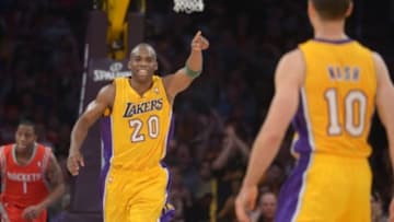 Apr 8, 2014; Los Angeles, CA, USA; Los Angeles Lakers guard Jodie Meeks (10) acknowledges Steve Nash (10) after Meeks scored on assist by Nash to pass Mark Jackson (not pictured) to move into third on the all-time NBA assist list in the second quarter against the Houston Rockets at Staples Center. Mandatory Credit: Kirby Lee-USA TODAY Sports