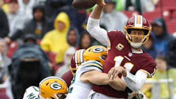 LANDOVER, MD - SEPTEMBER 23: Clay Matthews #52 of the Green Bay Packers hits quarterback Alex Smith #11 of the Washington Redskins in the first half at FedExField on September 23, 2018 in Landover, Maryland. (Photo by Rob Carr/Getty Images)