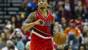 Dec 22, 2014; Houston, TX, USA; Portland Trail Blazers guard Damian Lillard (0) brings the ball up the court during the fourth quarter against the Houston Rockets at Toyota Center. Mandatory Credit: Troy Taormina-USA TODAY Sports
