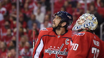 WASHINGTON, DC - APRIL 24: Alex Ovechkin #8 and Braden Holtby #70 of the Washington Capitals watch a replay after Sebastian Aho #20 of the Carolina Hurricanes (not pictured) scored a goal in the second period in Game Seven of the Eastern Conference First Round during the 2019 NHL Stanley Cup Playoffs at Capital One Arena on April 24, 2019 in Washington, DC. (Photo by Patrick McDermott/NHLI via Getty Images)