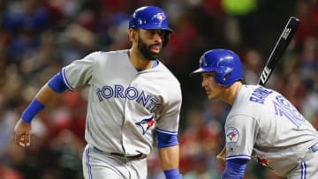May 13, 2016; Arlington, TX, USA; Toronto Blue Jays right fielder Jose Bautista (19) celebrates his run with second baseman Darwin Barney (18) against the Texas Rangers at Globe Life Park in Arlington. The Blue Jays won 5-0. Mandatory Credit: Jim Cowsert-USA TODAY Sports