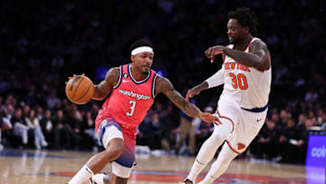 NEW YORK, NEW YORK - JANUARY 18: Bradley Beal #3 of the Washington Wizards is guarded by Julius Randle #30 of the New York Knicks during the fourth quarter of the game at Madison Square Garden on January 18, 2023 in New York City. NOTE TO USER: User expressly acknowledges and agrees that, by downloading and or using this photograph, User is consenting to the terms and conditions of the Getty Images License Agreement. (Photo by Dustin Satloff/Getty Images)