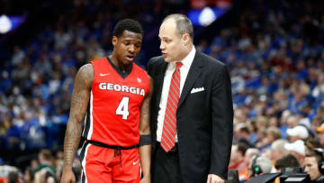 ST LOUIS, MO - MARCH 09: Mark Fox the head coach of the Georgia Bulldogs talks with Tyree Crump