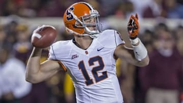 Sept 22, 2012; Minneapolis, MN, USA: Syracuse Orange quarterback Ryan Nassib (12) throws a pass in the second half against the Minnesota Golden Gophers at TCF Bank Stadium. The Gophers won 17-10. Mandatory Credit: Jesse Johnson-USA TODAY Sports