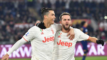 Cristiano Ronaldo (L) celebrates with Juventus' Bosnian midfielder Miralem Pjanic (Photo by Tiziana FABI / AFP) (Photo by TIZIANA FABI/AFP via Getty Images)