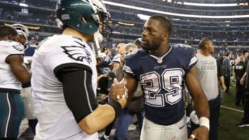 Nov 27, 2014; Arlington, TX, USA; Philadelphia Eagles quarterback Mark Sanchez (3) meets with Dallas Cowboys running back DeMarco Murray (29) after the game at AT&T Stadium.The Eagles beat the Cowboys 33-10. Mandatory Credit: Matthew Emmons-USA TODAY Sports
