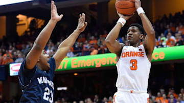 Nov 18, 2016; Syracuse, NY, USA; Syracuse Orange guard Andrew White III (3) shoots the ball as Monmouth Hawks guard Austin Tilghman (23) defends during the first half at the Carrier Dome. Mandatory Credit: Rich Barnes-USA TODAY Sports