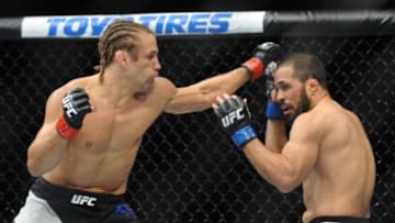 December 12, 2015; Las Vegas, NV, USA; Urijah Faber lands a punch against Frankie Saenz during UFC 194 at MGM Grand Garden Arena. Mandatory Credit: Gary A. Vasquez-USA TODAY Sports