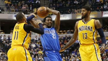 Dec 16, 2015; Indianapolis, IN, USA; Dallas Mavericks forward Jeremy Evans (21) is guarded by Indiana Pacers guard Monta Ellis (11) and forward Paul George (13) at Bankers Life Fieldhouse. Indiana defeats Dallas 107-81. Mandatory Credit: Brian Spurlock-USA TODAY Sports