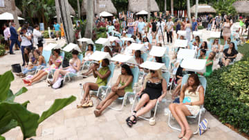 The crowd listening to SI Swimsuit panel discussions in Sunflow chairs at 2022 launch week.