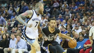 Apr 9, 2016; Memphis, TN, USA; Golden State Warriors guard Stephen Curry (30) dribbles the ball as Memphis Grizzlies center Chris Anderesen (7) defends in the second quarter at FedExForum. Mandatory Credit: Nelson Chenault-USA TODAY Sports