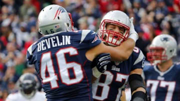Oct 26, 2014; Foxborough, MA, USA; New England Patriots tight end Rob Gronkowski (87) celebrates with fullback James Develin (46) after scoring a touchdown before leaving the field for an injury during the third quarter of against the Chicago Bears at Gillette Stadium. The Patriots won 51-23. Mandatory Credit: Winslow Townson-USA TODAY Sports