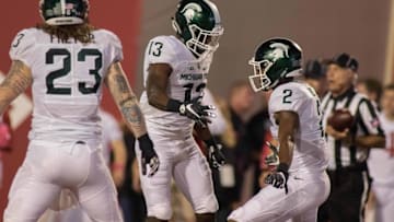 Oct 1, 2016; Bloomington, IN, USA; Michigan State Spartans defensive back Justin Williams (13) celebrates his interception with teammates in the second quarter of the game at Memorial Stadium. Mandatory Credit: Trevor Ruszkowski-USA TODAY Sports