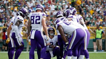 GREEN BAY, WI - SEPTEMBER 16: Kirk Cousins #8 of the Minnesota Vikings calls a play in the huddle during the game against the Green Bay Packers at Lambeau Field on September 16, 2018 in Green Bay, Wisconsin. The game ended in a 29-29 tie. (Photo by Joe Robbins/Getty Images)