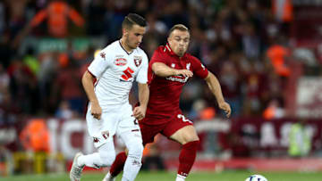 LIVERPOOL, ENGLAND - AUGUST 07: Xherdan Shaqiri of Liverpool battles with Alejandro Berenguer of Torino during the pre-season friendly match between Liverpool and Torino at Anfield on August 7, 2018 in Liverpool, England. (Photo by Jan Kruger/Getty Images)