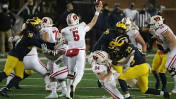 Michigan Wolverines' Michael Barrett (23) rushes Wisconsin Badgers' Graham Mertz during the second half at Michigan Stadium in Ann Arbor, Saturday, Nov. 14, 2020.Wolverines