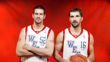 LOS ANGELES - FEBRUARY 15: Brad Miller #52 and Peja Stojakovic #16 of the Western Conference All-Stars pose for a portrait on February 15, 2004 at the Staples Center in Los Angeles, California. NOTE TO USER: User expressly acknowledges and agrees that, by downloading and/or using this Photograph, User is consenting to the terms and conditions of the Getty Images License Agreement. (Photo by Nathaniel S. Butler/NBAE via Getty Images)