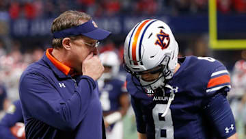 ATLANTA, GA - DECEMBER 02: Head coach Gus Malzahn of the Auburn Tigers talks to his quarterback, Jarrett Stidham