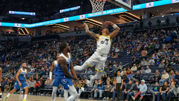 Nov 4, 2023; Minneapolis, Minnesota, USA; Utah Jazz guard Keyonte George (3) shoots against Minnesota Timberwolves guard Shake Milton (18) in the fourth quarter at Target Center. Mandatory Credit: Matt Blewett-USA TODAY Sports
