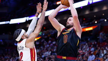 MIAMI, FLORIDA - DECEMBER 01: Kevin Love #0 of the Cleveland Cavaliers shoots over Gabe Vincent #2 of the Miami Heat during the first half at FTX Arena on December 01, 2021 in Miami, Florida. NOTE TO USER: User expressly acknowledges and agrees that, by downloading and or using this photograph, User is consenting to the terms and conditions of the Getty Images License Agreement. (Photo by Michael Reaves/Getty Images)